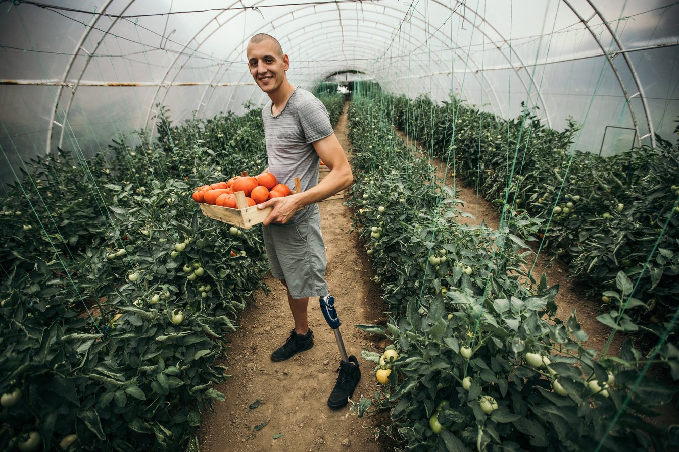 Disability guy working on farm