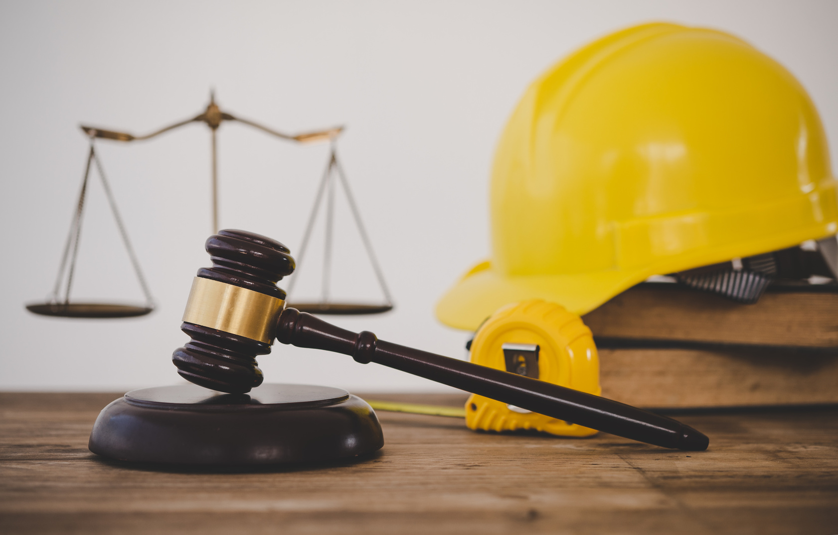 Judge's hammer and helmet Law and Justice about labor law concep