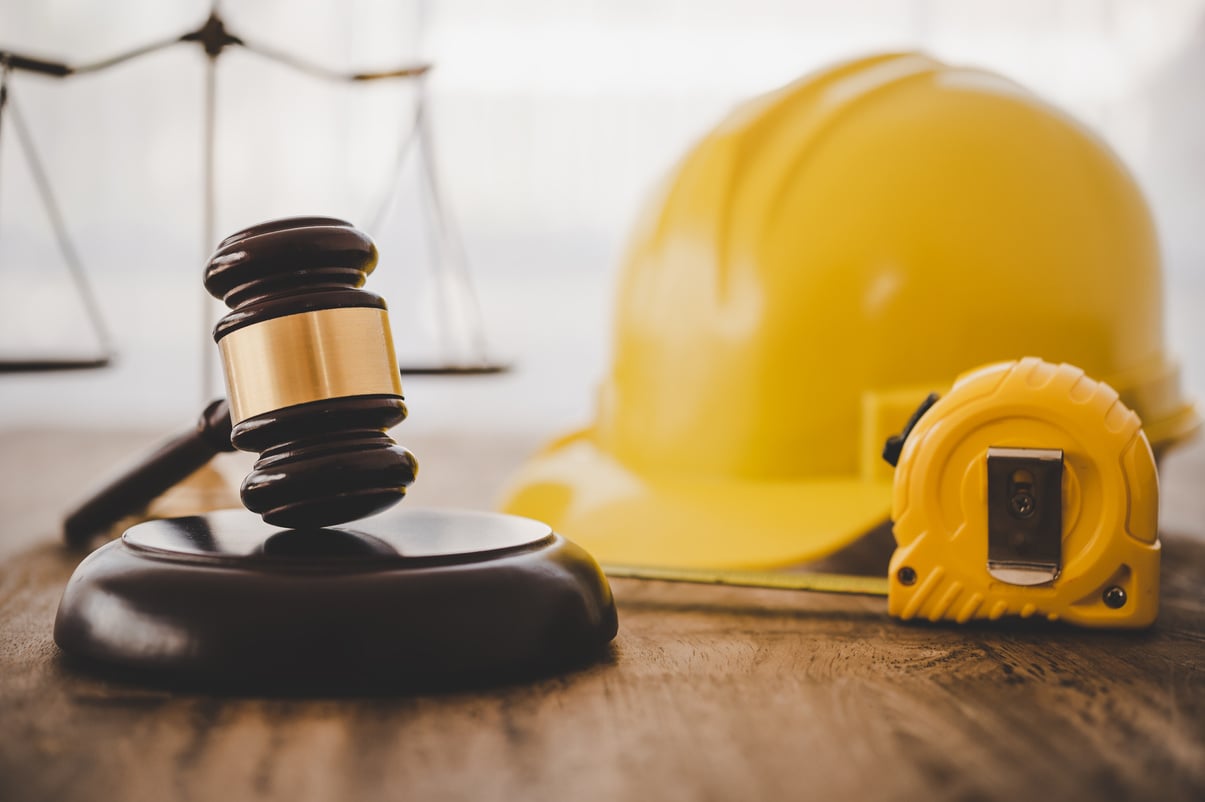 Judge's hammer and helmet Law and Justice about labor law concep